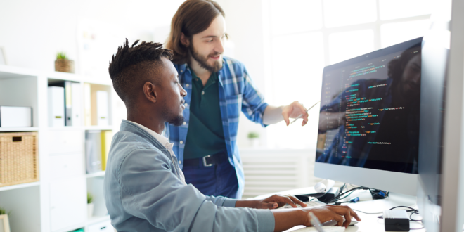 People coding on a computer